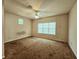 Simple bedroom with neutral walls, ceiling fan, carpeted floors and a window with natural light at 185 Lander Dr., Conway, SC 29526