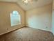Inviting bedroom with neutral walls, ceiling fan and window with blinds allowing sunlight at 185 Lander Dr., Conway, SC 29526