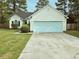Charming single-story home with a two-car garage, well-kept lawn, and mature trees at 185 Lander Dr., Conway, SC 29526