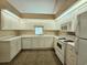Bright kitchen with white cabinetry, appliances, and ample counter space at 185 Lander Dr., Conway, SC 29526