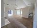 Open-concept living space with neutral walls, carpeting, and bright natural light offering renovation potential at 185 Lander Dr., Conway, SC 29526