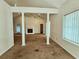 Spacious living room with high ceilings, fireplace, decorative columns, and plenty of natural light at 185 Lander Dr., Conway, SC 29526