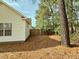 A fenced side yard provides a private outdoor space near mature trees at 185 Lander Dr., Conway, SC 29526