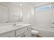 Well-lit bathroom featuring a white vanity, a bathtub and shower combination, and wood-look flooring at 192 Six Mile Creek Dr., Georgetown, SC 29440