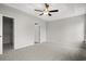 This bedroom has a ceiling fan, neutral paint, and access to a closet and bathroom at 192 Six Mile Creek Dr., Georgetown, SC 29440