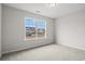 Neutral bedroom with a large window offering a view of the neighborhood and neutral carpet at 192 Six Mile Creek Dr., Georgetown, SC 29440