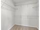Walk-in closet with wire shelving for ample storage space, and neutral carpeting at 192 Six Mile Creek Dr., Georgetown, SC 29440