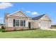 Charming single-Gathering home with white siding, brick accents, blue shutters and a well-maintained lawn at 192 Six Mile Creek Dr., Georgetown, SC 29440