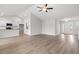 Bright living room features wood-look floors and neutral paint, open to kitchen and dining areas at 192 Six Mile Creek Dr., Georgetown, SC 29440