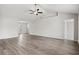 Spacious living room boasts wood-look floors, modern ceiling fan, and plenty of natural light at 192 Six Mile Creek Dr., Georgetown, SC 29440