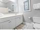 Well-lit bathroom featuring a framed mirror, vanity with storage, and white toilet at 200 53Rd Ave. N # 511, North Myrtle Beach, SC 29582