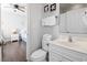 Light and bright bathroom with a single sink vanity, mirror, and commode at 200 53Rd Ave. N # 511, North Myrtle Beach, SC 29582