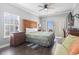 Bedroom featuring a large bed, wood furniture, ceiling fan, and access to a private balcony at 200 53Rd Ave. N # 511, North Myrtle Beach, SC 29582