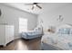 Bright bedroom with two beds, wood floors, and coastal decor at 200 53Rd Ave. N # 511, North Myrtle Beach, SC 29582
