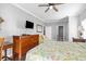 Bright bedroom with TV, dresser, and a large bed complemented by an attached bathroom with a door visible at 200 53Rd Ave. N # 511, North Myrtle Beach, SC 29582