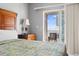 Bedroom featuring a large bed, wood furniture, ceiling fan, and access to a private balcony at 200 53Rd Ave. N # 511, North Myrtle Beach, SC 29582