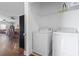 Practical laundry area with washer, dryer, and overhead shelving for storage at 200 53Rd Ave. N # 511, North Myrtle Beach, SC 29582