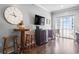 Cozy living room with bar-height table, TV, and sliding glass doors to a balcony with a view at 200 53Rd Ave. N # 511, North Myrtle Beach, SC 29582