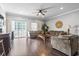 Inviting living room with hardwood floors, comfortable seating, and a balcony at 200 53Rd Ave. N # 511, North Myrtle Beach, SC 29582