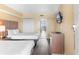 Cozy bedroom with two beds, a mounted TV, and a doorway to the balcony providing natural light and comfort at 2000 Ocean Blvd. N # Ph11, Myrtle Beach, SC 29577