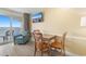 Inviting dining area with comfortable seating and ocean views, perfect for enjoying meals and relaxing moments at 2000 Ocean Blvd. N # Ph11, Myrtle Beach, SC 29577