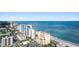 Beautiful aerial view of high-rise buildings, street, and stunning oceanfront beach at 2000 Ocean Blvd. N # Ph12, Myrtle Beach, SC 29577