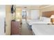 Comfortable bedroom featuring two double beds, a dresser, and a picturesque ocean view at 2000 Ocean Blvd. N # Ph12, Myrtle Beach, SC 29577