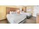 Comfortable bedroom featuring two beds, a nightstand, and a large window at 2000 Ocean Blvd. N # Ph12, Myrtle Beach, SC 29577