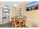 Comfortable dining area features seating for four and is adjacent to kitchen at 2000 Ocean Blvd. N # Ph12, Myrtle Beach, SC 29577