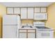Efficient kitchen with white appliances, cabinets, and countertops for convenience at 2000 Ocean Blvd. N # Ph12, Myrtle Beach, SC 29577