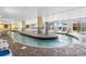 Indoor pool with a lazy river and lounge chairs at 2000 Ocean Blvd. N # Ph12, Myrtle Beach, SC 29577