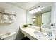 Well-lit bathroom with a vanity, large mirror, and plush towels, creating a spa-like atmosphere at 201 74Th Ave. N # 2638, Myrtle Beach, SC 29572