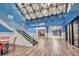 Bright lobby area with stairs leading to the Beachfront Kitchen & Bar, inviting guests to enjoy music, food, and drinks at 201 74Th Ave. N # 2638, Myrtle Beach, SC 29572
