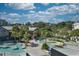 Aerial view of a waterpark with a lazy river, buildings, trees, and other recreational features, promising fun for all ages at 201 74Th Ave. N # 2638, Myrtle Beach, SC 29572