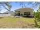 Spacious backyard featuring a patio, and well-maintained lawn at 205 Carriage Lake Dr., Little River, SC 29566