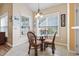 Bright breakfast nook with wicker chairs and a glass-top table near large windows at 205 Carriage Lake Dr., Little River, SC 29566