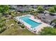 Spacious community pool area with lounge chairs and shaded tables, perfect for relaxation at 205 Carriage Lake Dr., Little River, SC 29566