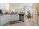 Bright kitchen view with stainless steel dishwasher, and breakfast nook at 205 Carriage Lake Dr., Little River, SC 29566