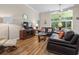 Open living room with vaulted ceilings, a ceiling fan, and a view to the outdoors at 205 Carriage Lake Dr., Little River, SC 29566