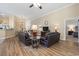 Spacious living room with open floor plan, wood floors, and comfortable seating at 205 Carriage Lake Dr., Little River, SC 29566