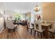 Open-concept design with a dining table and living room at 205 Carriage Lake Dr., Little River, SC 29566