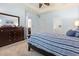 Main bedroom with ensuite bathroom access, carpet, dresser, and neutral wall paint at 205 Carriage Lake Dr., Little River, SC 29566