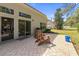 Charming patio featuring brick pavers, a grill, and ample seating at 205 Carriage Lake Dr., Little River, SC 29566