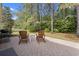 Relaxing patio featuring brick pavers and comfortable Adirondack chairs at 205 Carriage Lake Dr., Little River, SC 29566