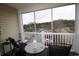 Enjoy the outdoors on this covered patio with a view of the parking area and surrounding trees at 2090 Cross Gate Blvd # 301, Myrtle Beach, SC 29575