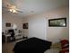 Bright bedroom with neutral walls, ceiling fan, and fan for air circulation at 2090 Cross Gate Blvd # 301, Myrtle Beach, SC 29575