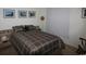 Cozy bedroom with soft lighting, neutral walls, bed, and framed pictures at 2090 Cross Gate Blvd # 301, Myrtle Beach, SC 29575