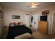 Cozy bedroom with soft lighting, neutral walls, ceiling fan, and storage options at 2090 Cross Gate Blvd # 301, Myrtle Beach, SC 29575