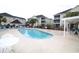 Community pool with plenty of lounge chairs and complex in the background at 2090 Cross Gate Blvd # 301, Myrtle Beach, SC 29575