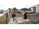 Outdoor grilling area with charcoal and stainless steel grills by the water at 2090 Cross Gate Blvd # 301, Myrtle Beach, SC 29575